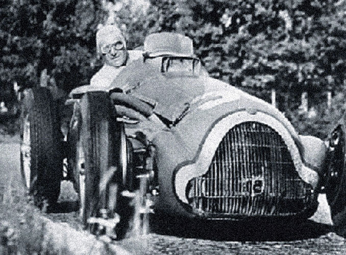 <p>Baron Philippe, a keen racing driver, at the wheel of his Bugatti during a Grand Prix.</p>
